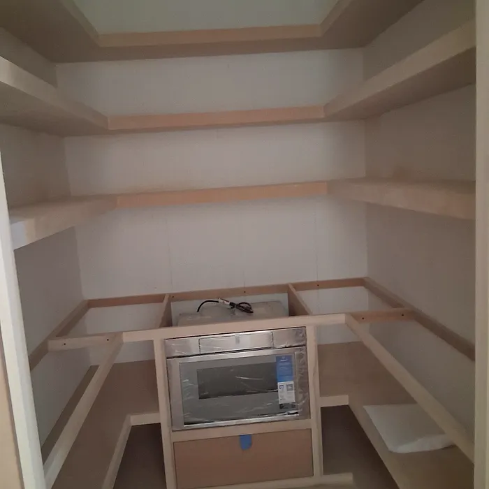 Built-in pantry shelving in a custom niche