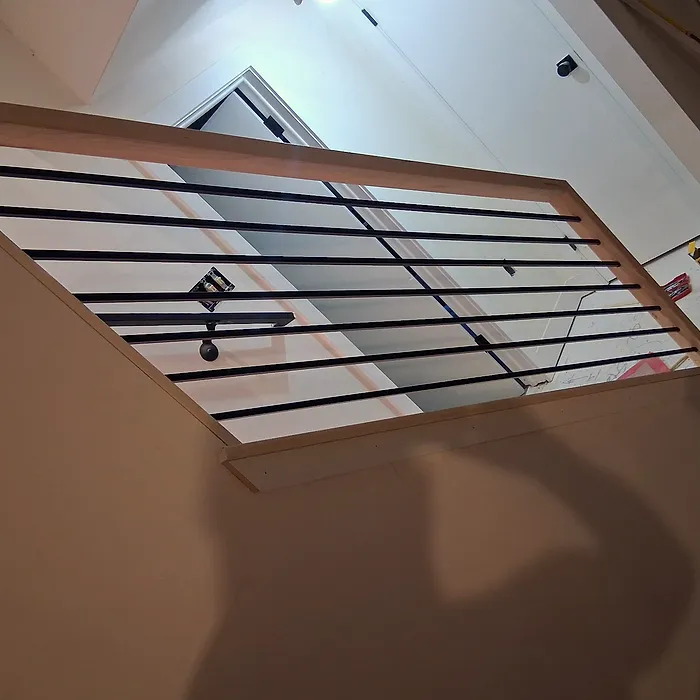 Staircase railing with iron balusters, overhead view