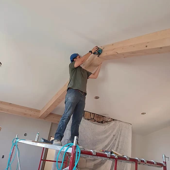 Exposed ceiling beam installation in progress