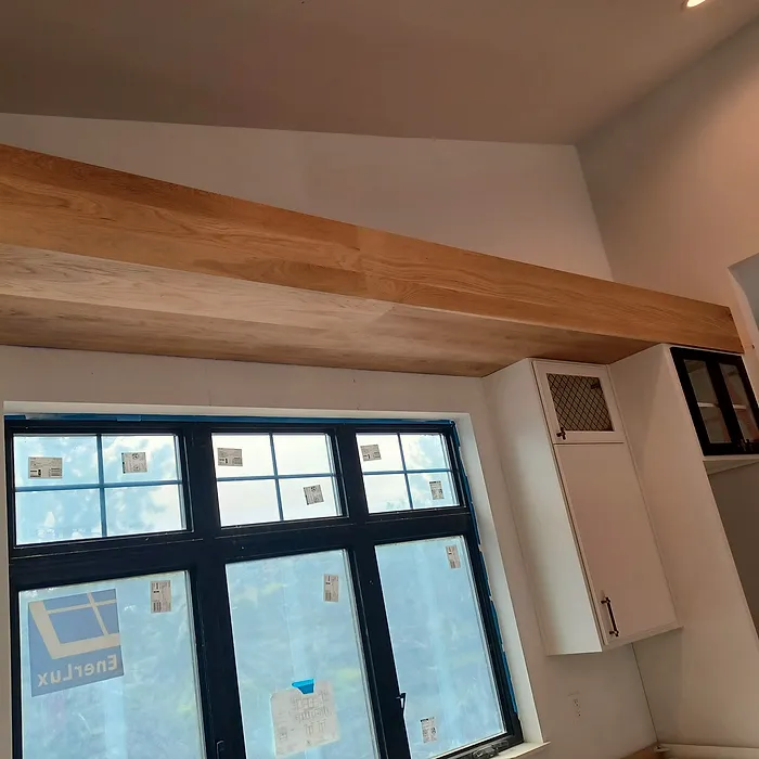 Exposed beam ceiling with custom window trim